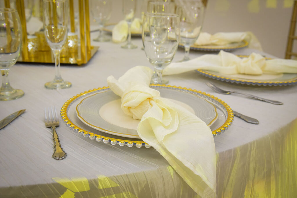 table with beautiful plates for wedding arya reception hall